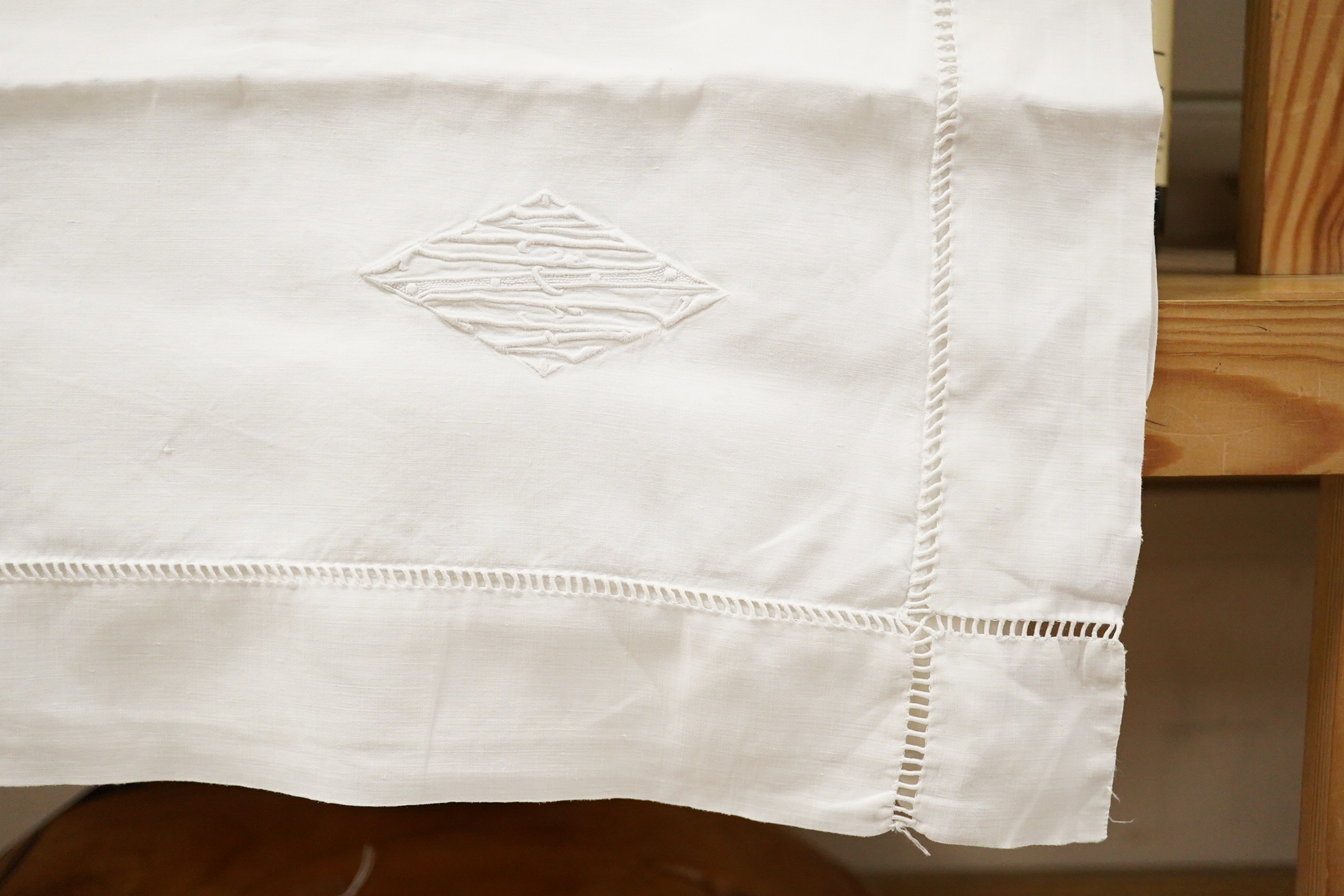 Two matching linen hand monogrammed sheets, one 216cm x 330cms, the other 212cm x 340 cms, together with three later monogrammed linen pillow cases and three embroidered cotton pillowcases.